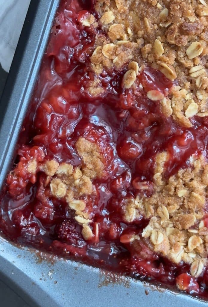 bubbling hot strawberry rhubarb crisp in pan