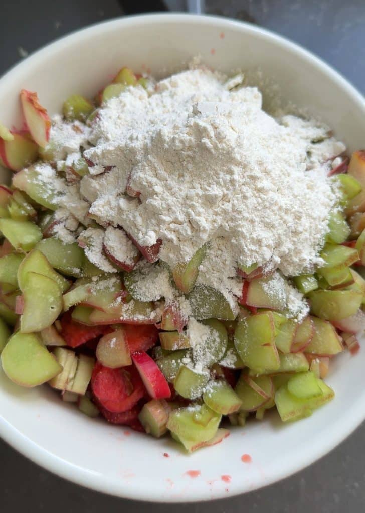 fruit with sugar and flour before stirring together