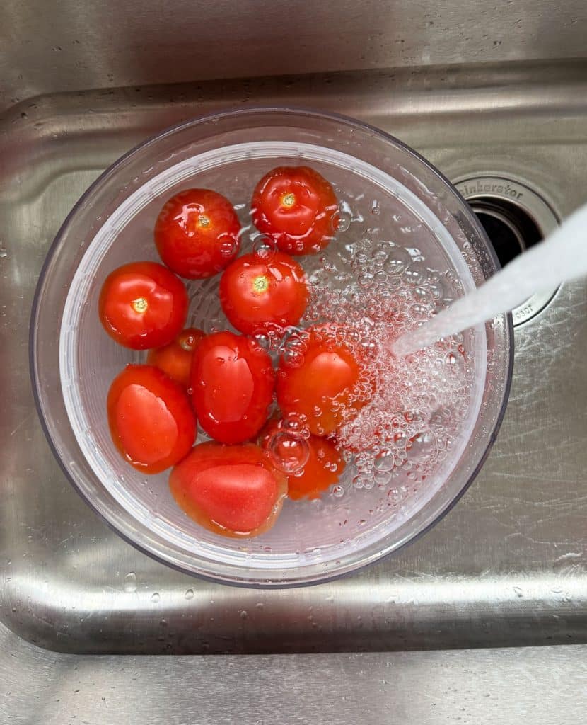IMG_1717 cleaning tomatoes in since in a colander