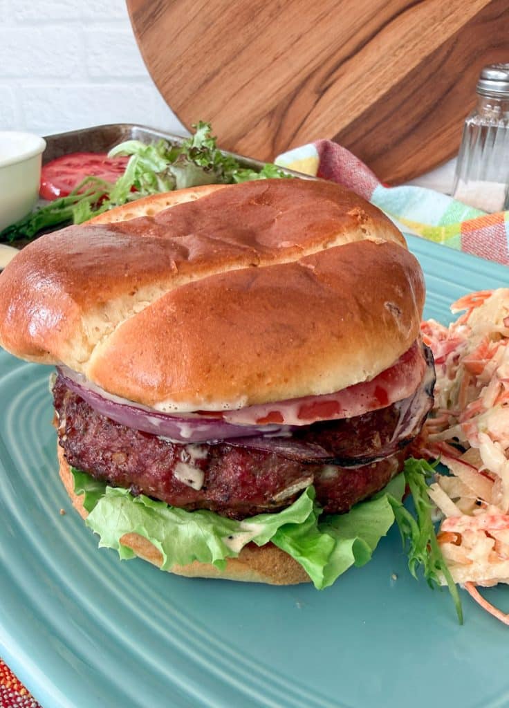 hawaiian hamburg on a plate with cole slaw