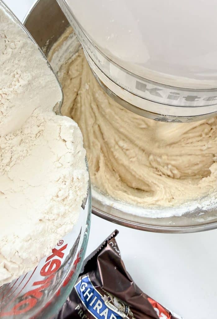 adding flour mixture to the wet ingredients gradually