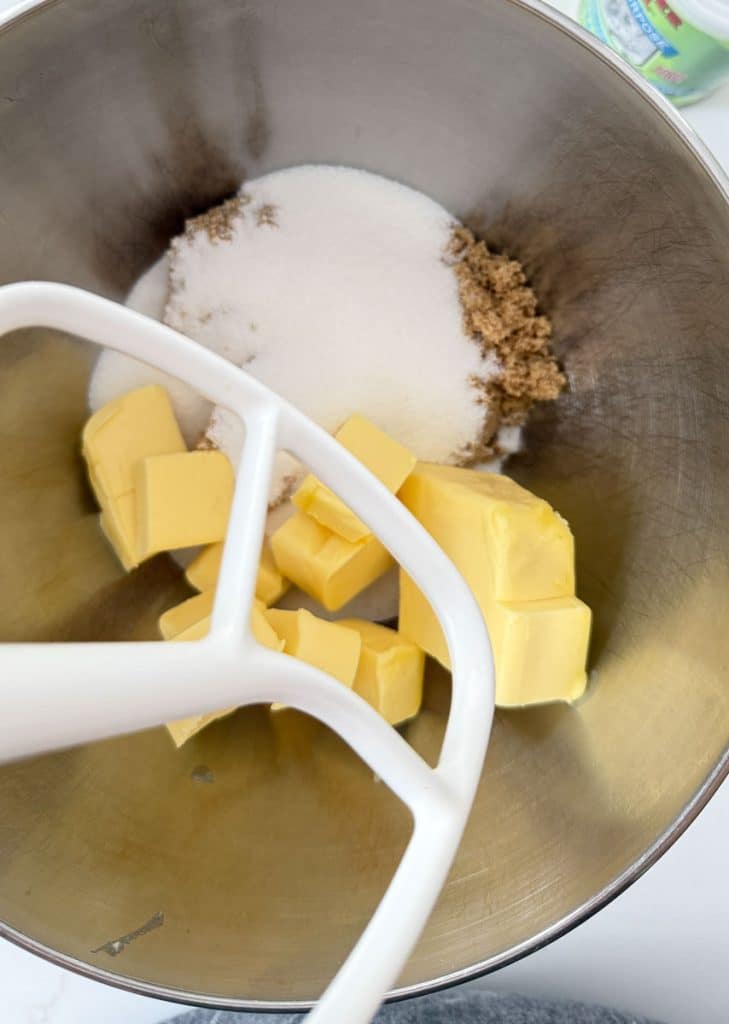 brown sugar granulated sugar and butter in the bottom of mixing bowl