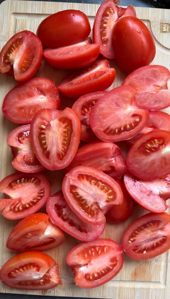 IMG_1718 sliced roma tomatoes on a wood cutting board