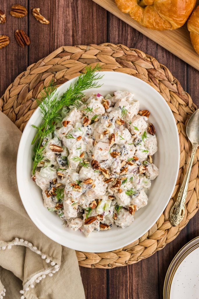 chicken salad with cherrys nuts and dill in bowl