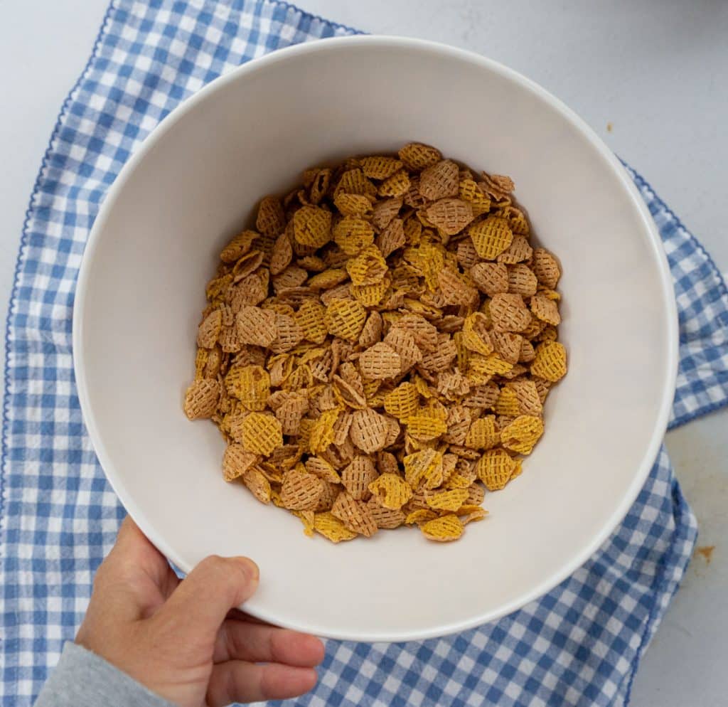 bowl of crispex cereal on a blue and white gingham cloth