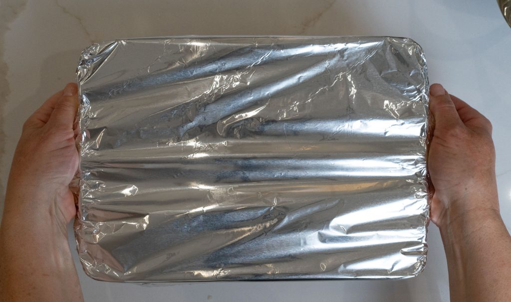 covering baking dish with aluminum foil before baking