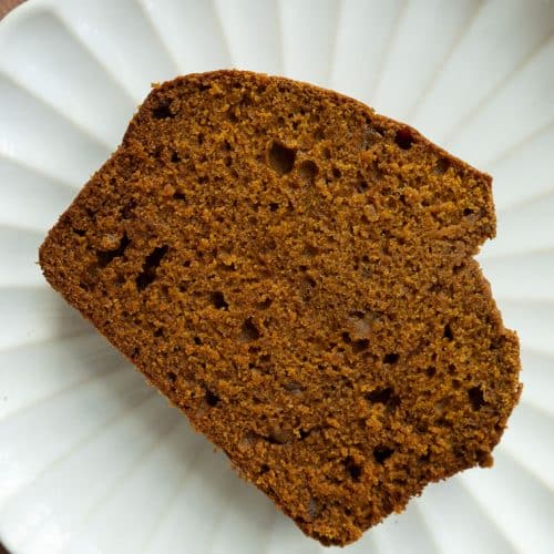slice of pumpkin gingerbread on a white plate.