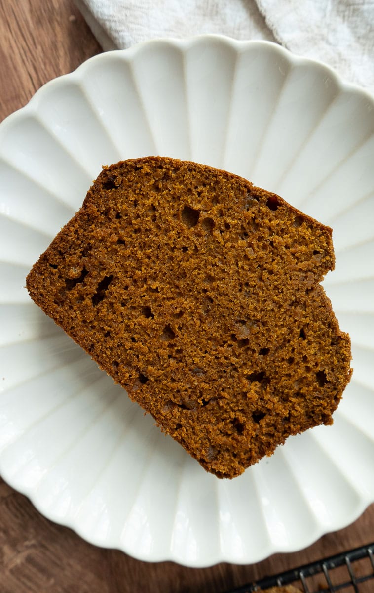 slice of pumpkin gingerbread on a white plate.