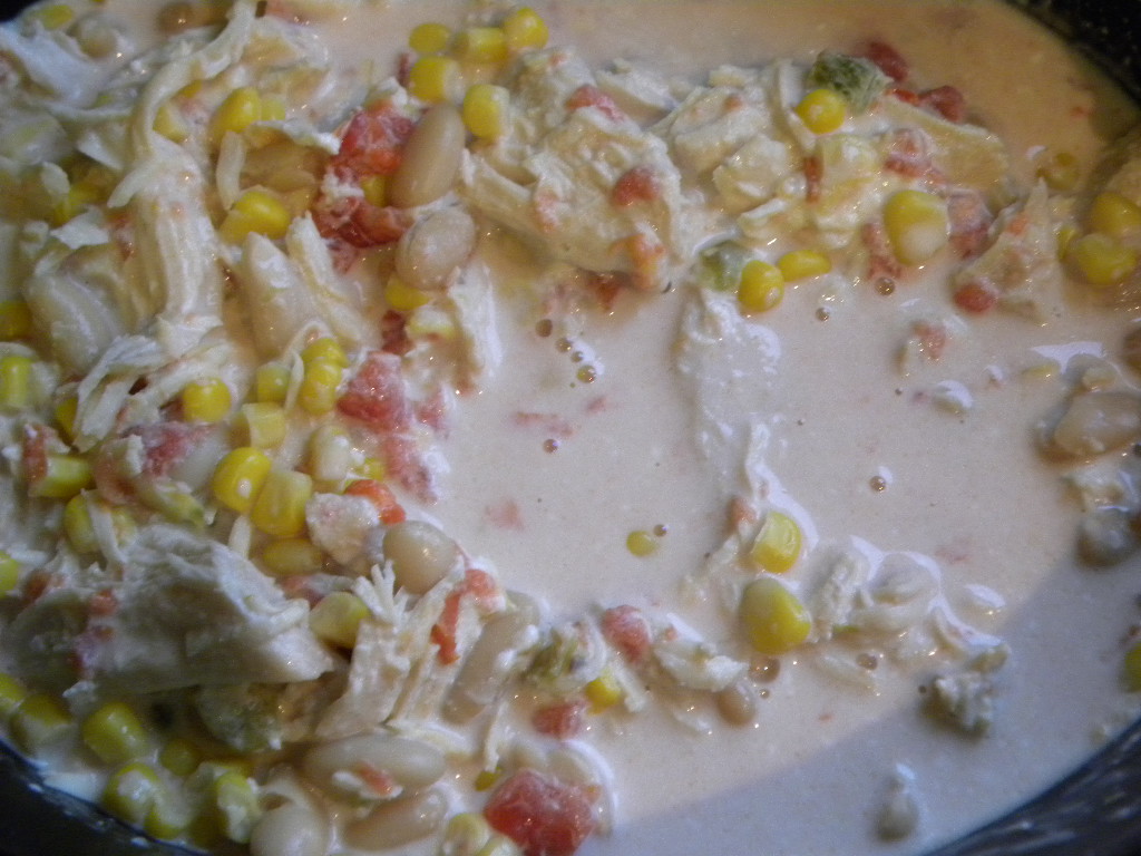 close up view of chicken and vegetable mixture in crock pot