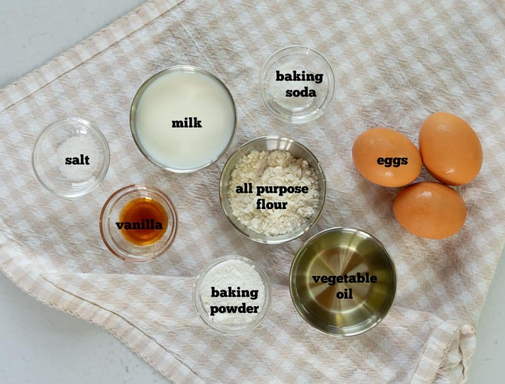 ingredients for freezer waffles on a tan an white checked cloth