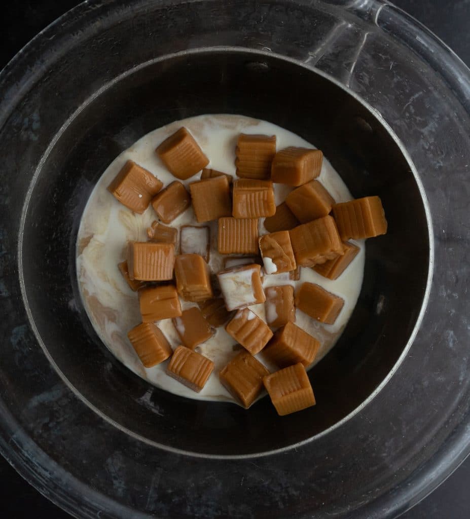 caramel candies in a double boiler with heavy whipping cream