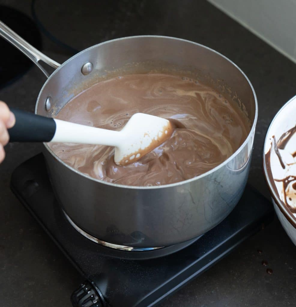 DSCN8297 stirring brownie batter custard on burner with a spatula