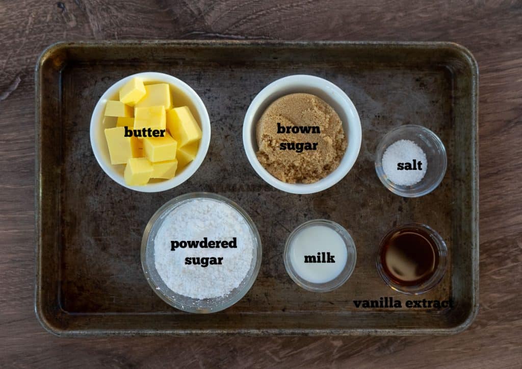 ingredients for pumpkin spice cookie frosting on a baking sheet