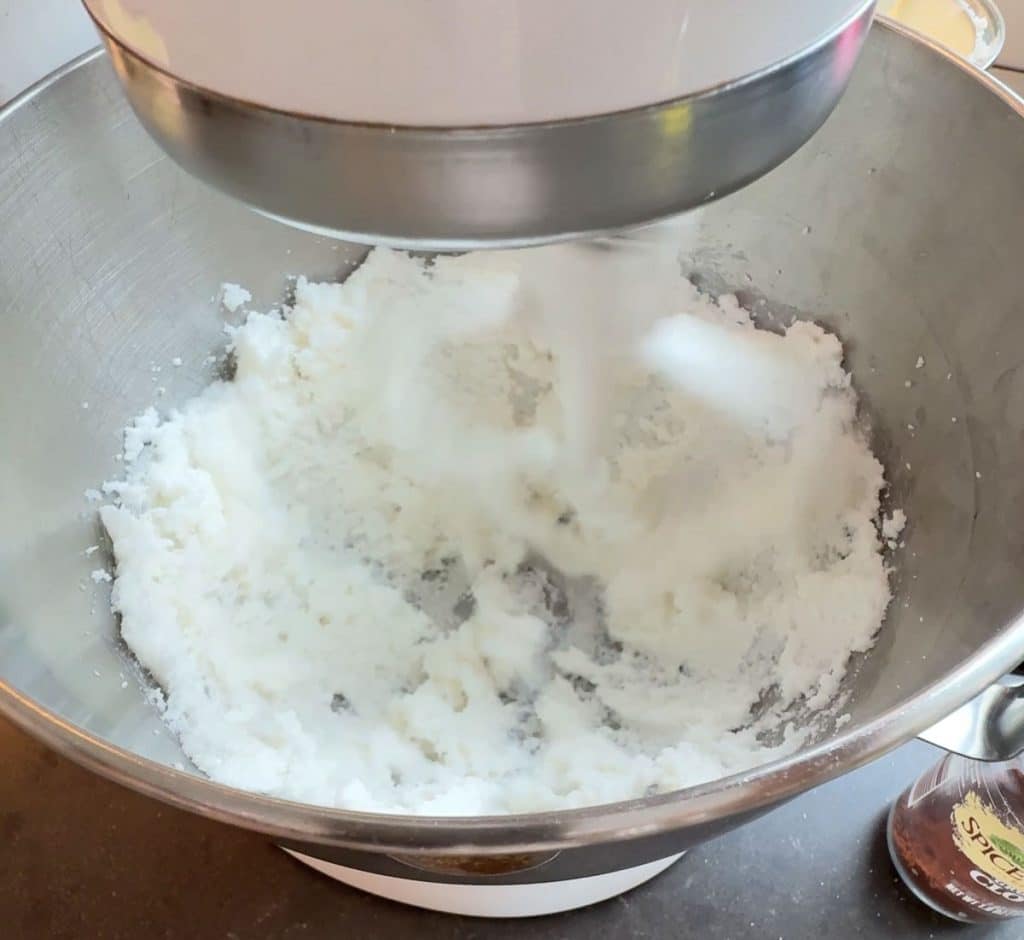 creaming together shortening and sugar in mixing bowl