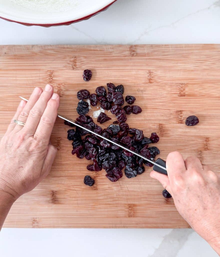 DSCN8789 chopping dried cherries on a wood cutting board