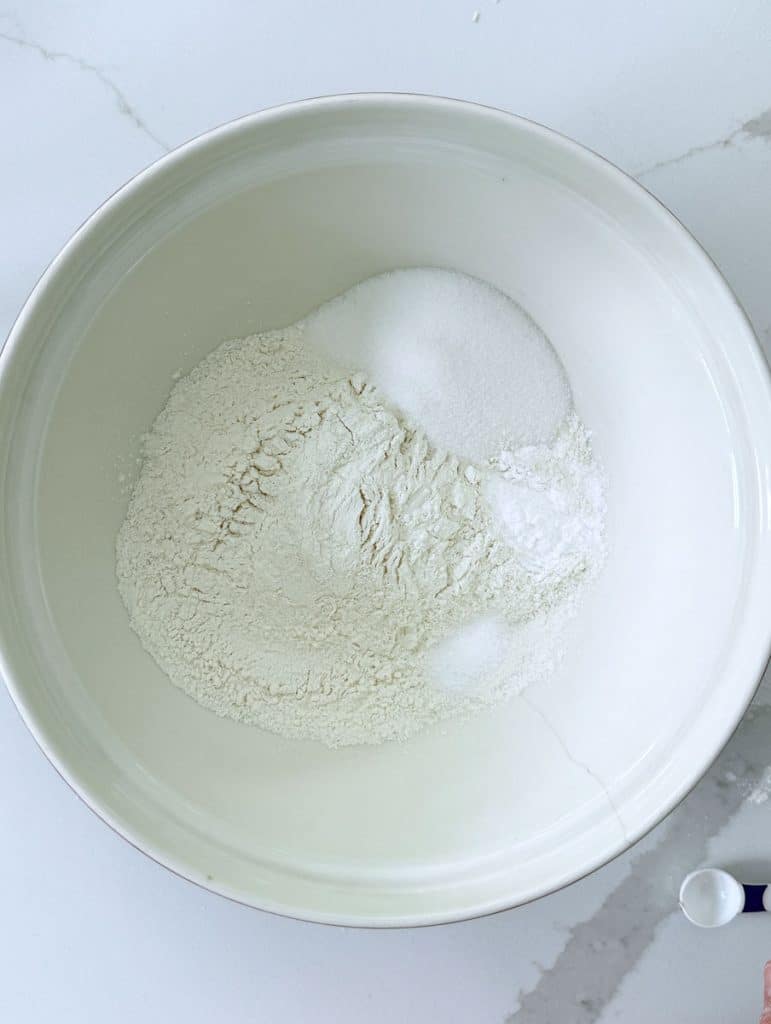 dry ingredients in a white bowl on a white countertop