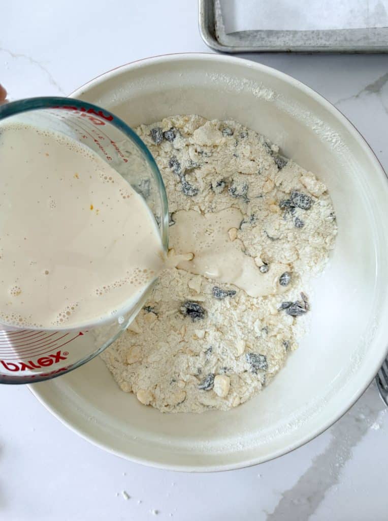 adding wet ingredients to the dry scone ingredients