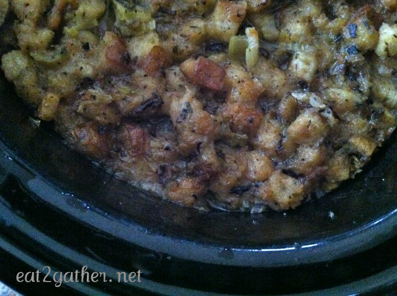 close up view of cooked stuffing in a crock pot