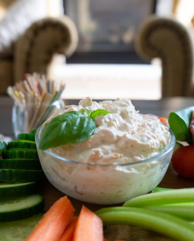 IMG_3905 bowl full of vegetable dip with basil for garnish surrounded by fresh cut vegetables