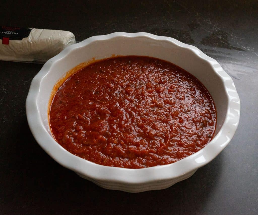 IMG_4254 white dish with marinara sauce in it