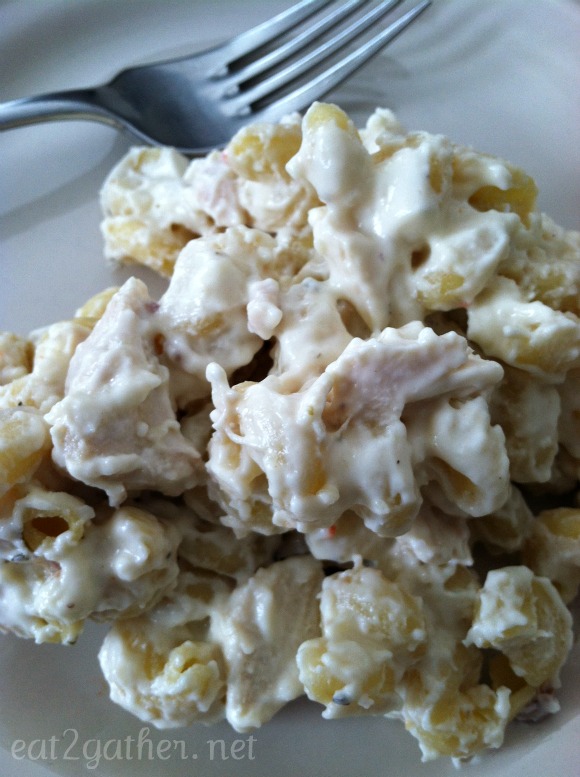 mound of chicken alfredo with a fork next to it