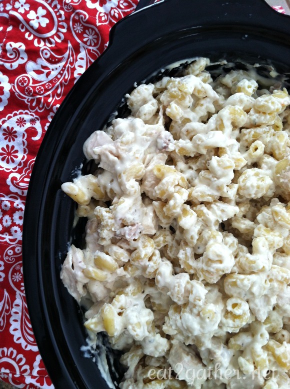 black crockpot full of chicken alfredo