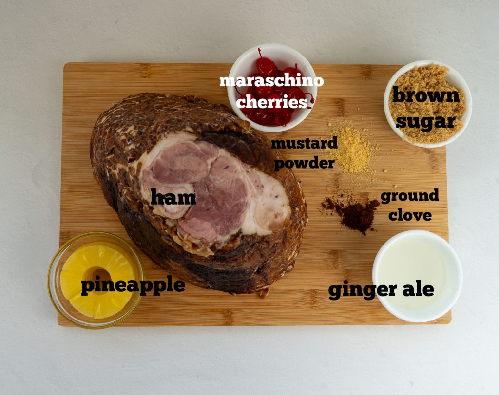 photo of recipe ingredients for Easter ham on a wood cutting board with a white background