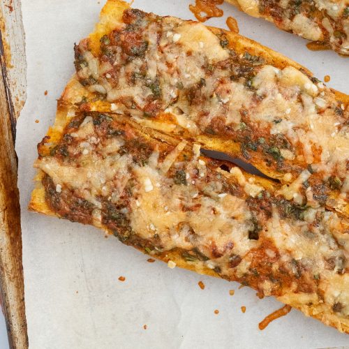 finished cilantro chili garlic bread on parchment line baking sheet