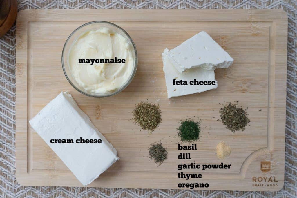 ingredients for feta herb dip on a wood cutting board