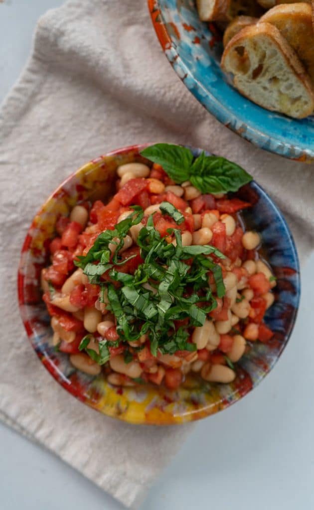 White bean bruschetta with fresh tomatoes, basil, and toasted baguette