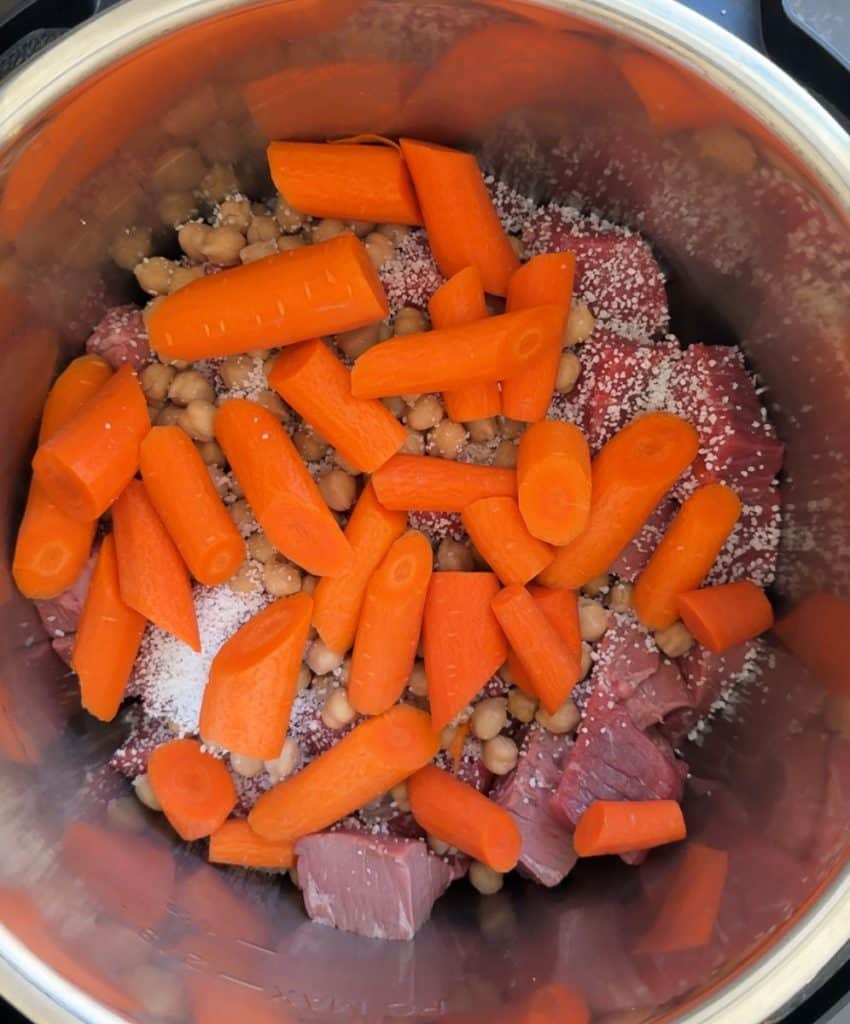 carrots, intant tapioca, on top of stew meat in slow cooker