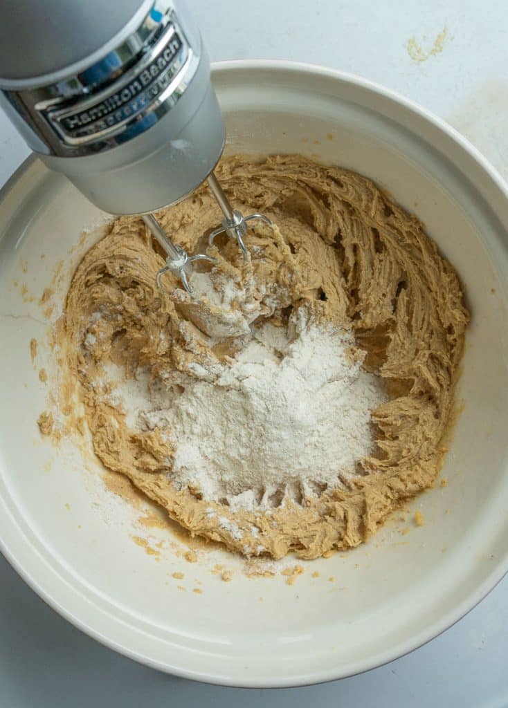 hand mixer mixing dough for brow sugar spice cookies
