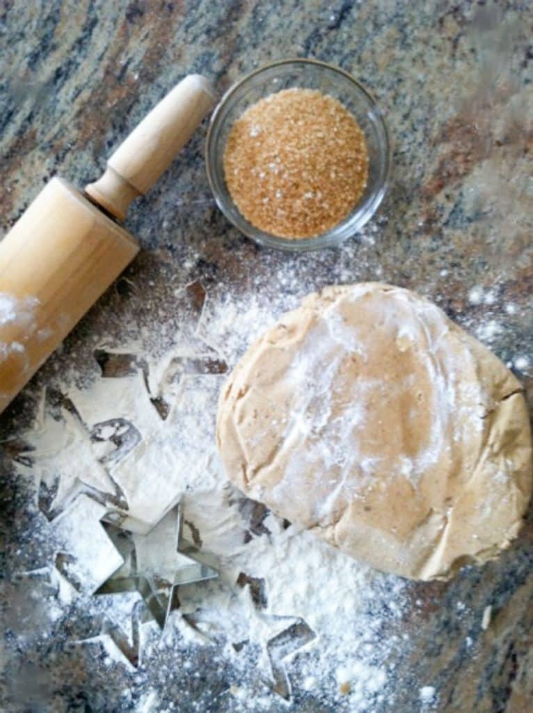 brown sugar spice cookie dough on a floured surface with rolling pin