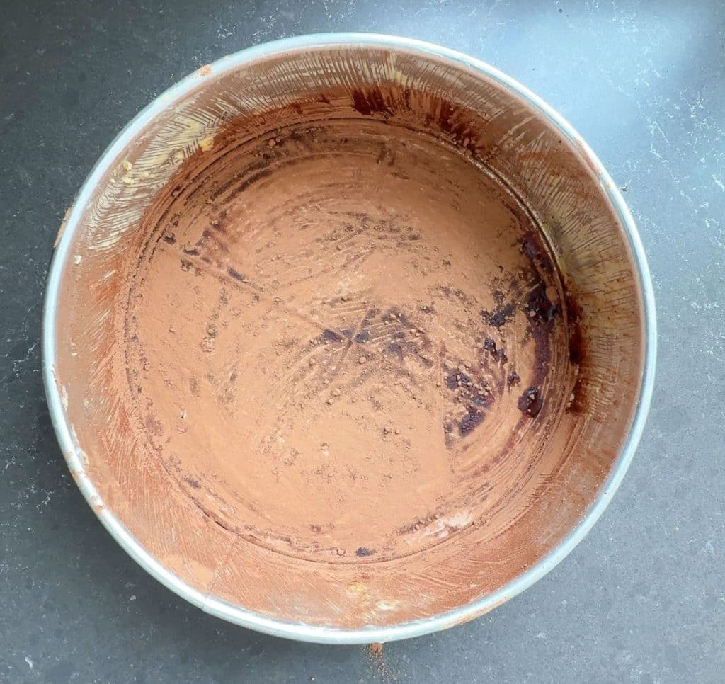 spring form cake pan greased and dusted with cocoa powder