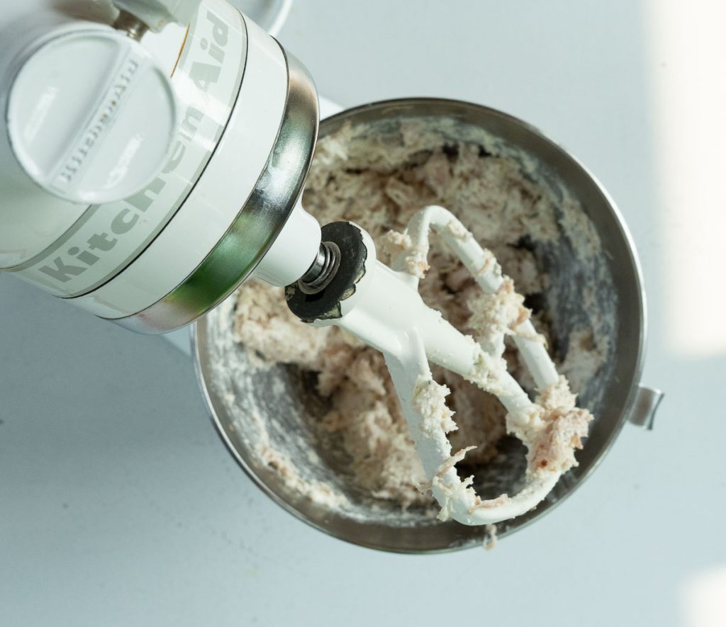 kitchen aid mixer with chicken ricotta mixture for stuffed shells