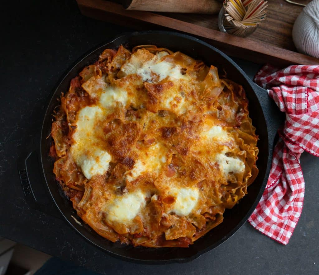 full pan of skillet lasagna on a black countertop