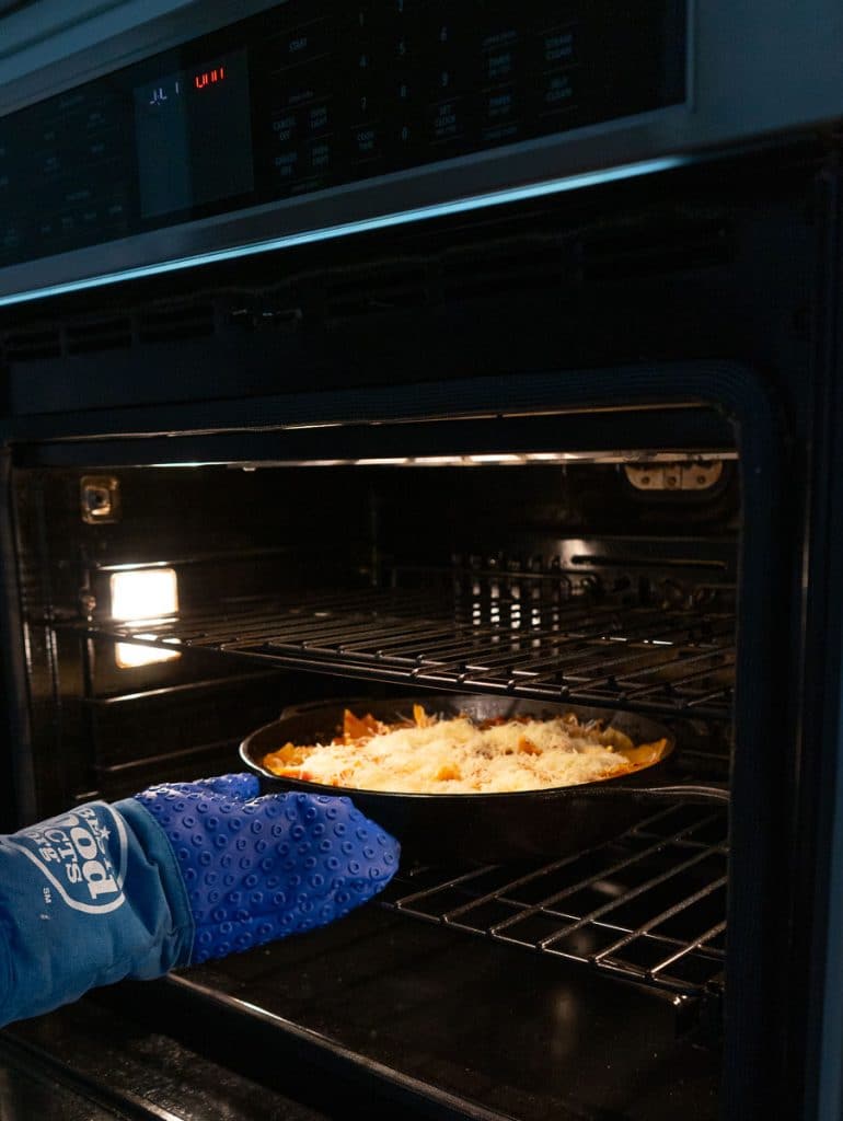 putting skillet lasagna in oven for a few minutes to brown the cheese on top of the lasagna