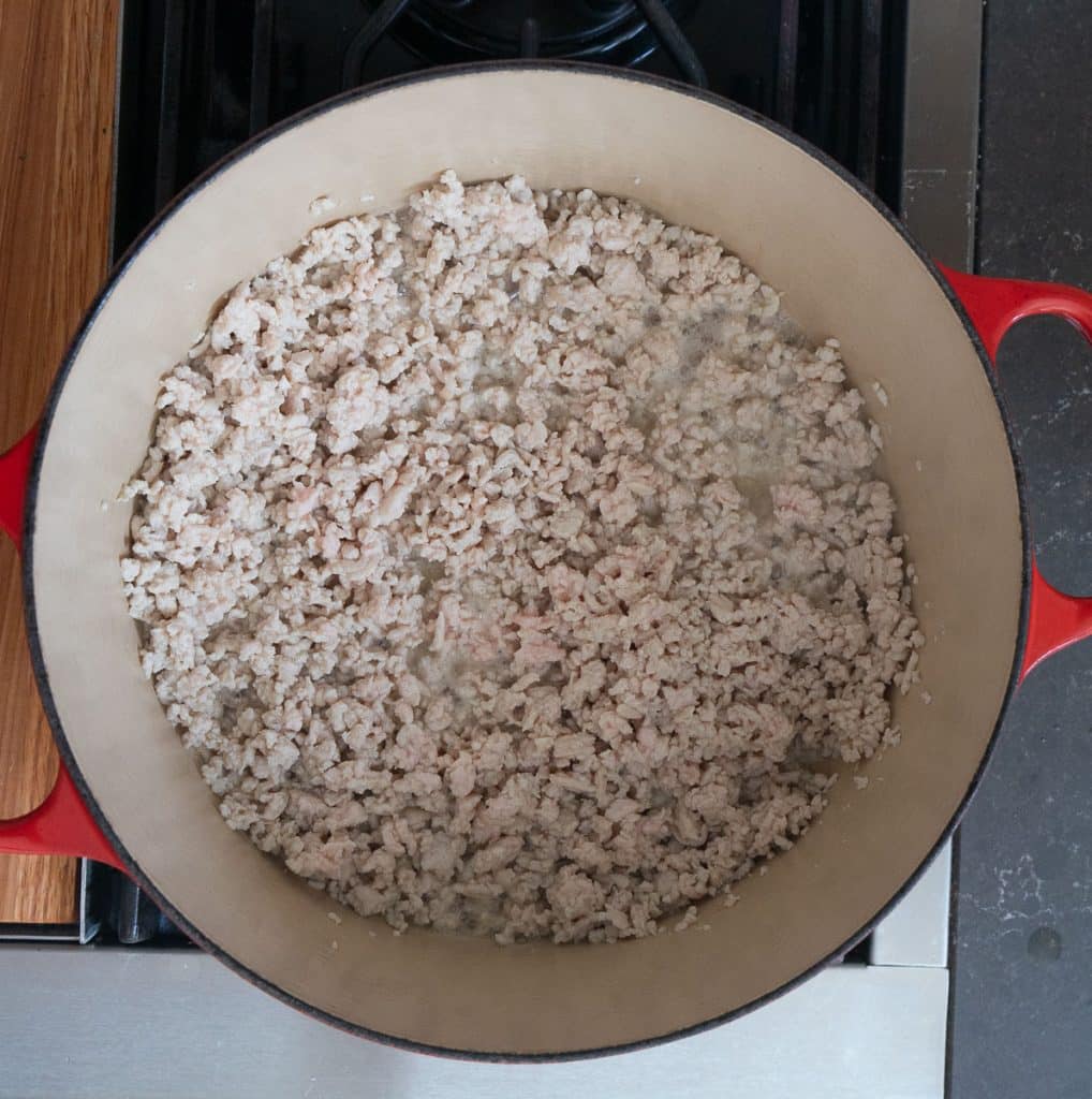 cooked ground turkey in a dutch oven on the stove top