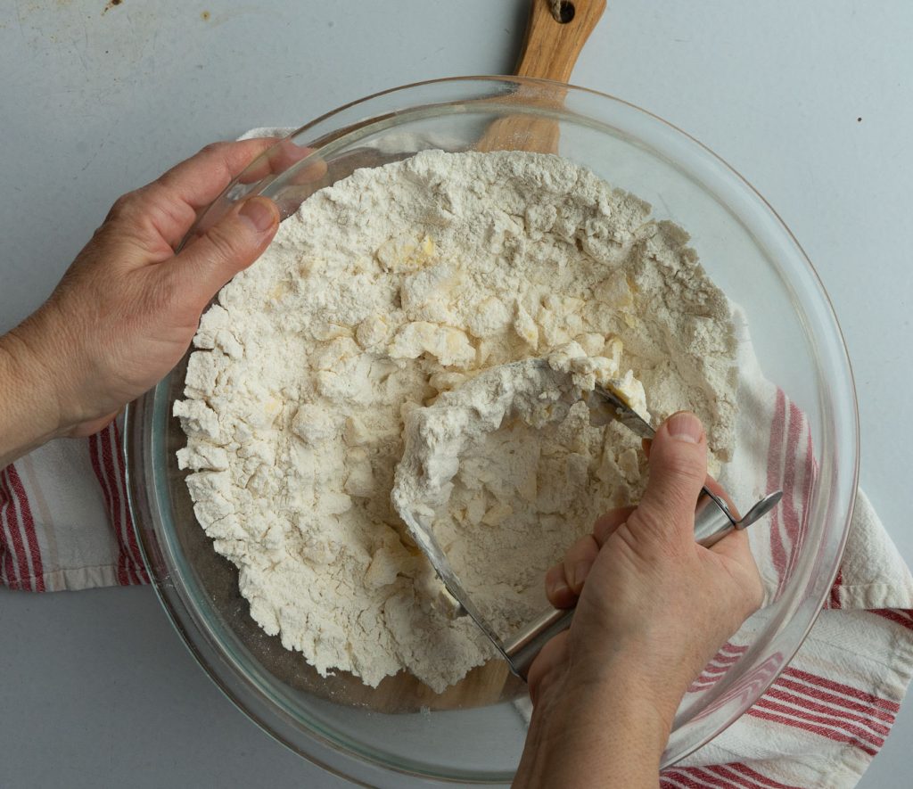 cutting butter into dry ingredients with pastry cutter