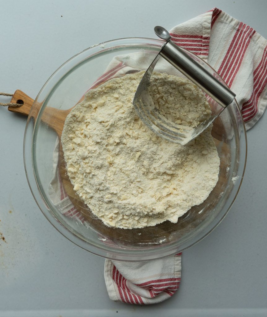 cutting butter into dry ingredients with a pastry cutter