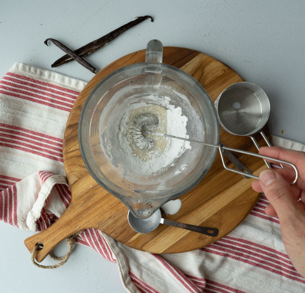 whisking icing ingredients together