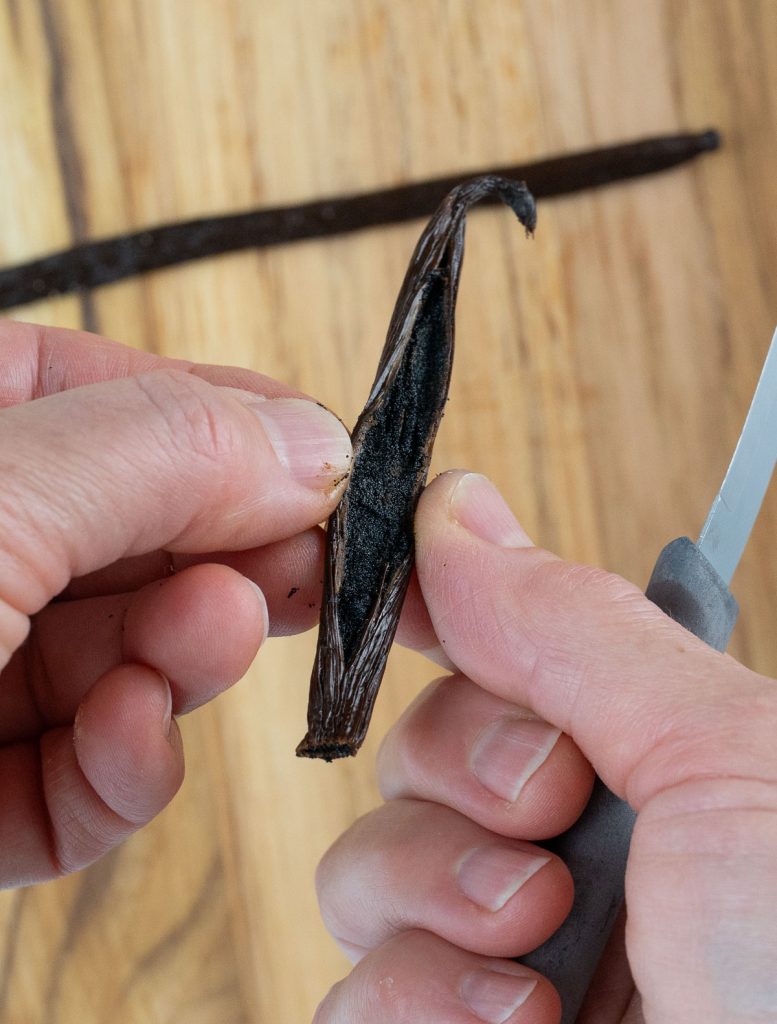 splitting vanilla bean with a knife