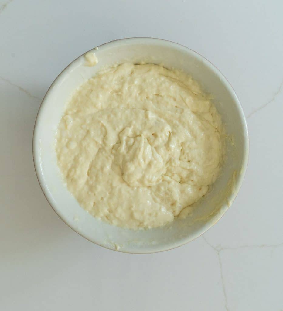 the best pancake batter resting in bowl on white counter top