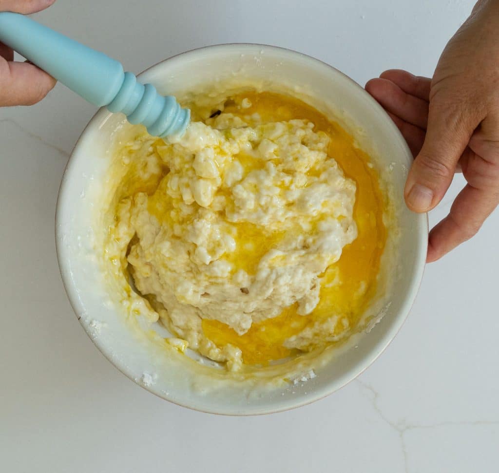 mixing in melted butter to the batter