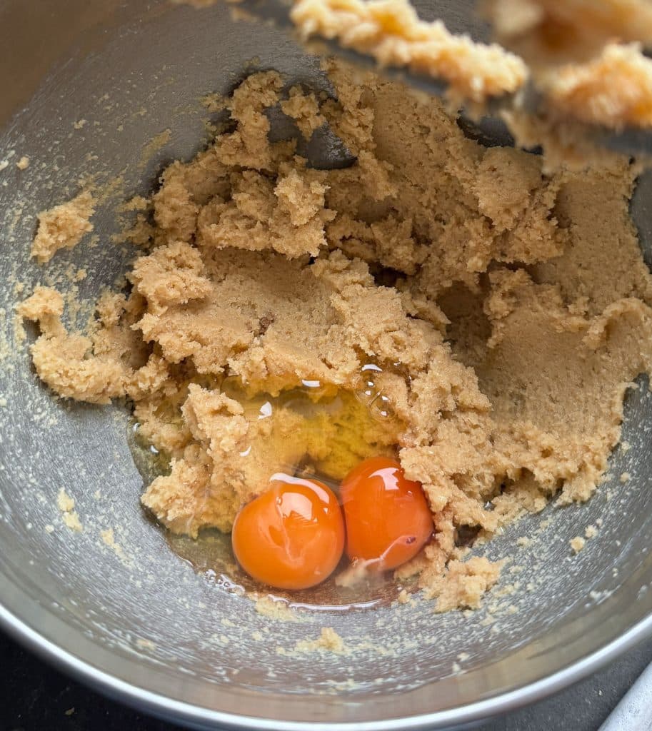eggs in mixing bowl with the butter sugar mixture