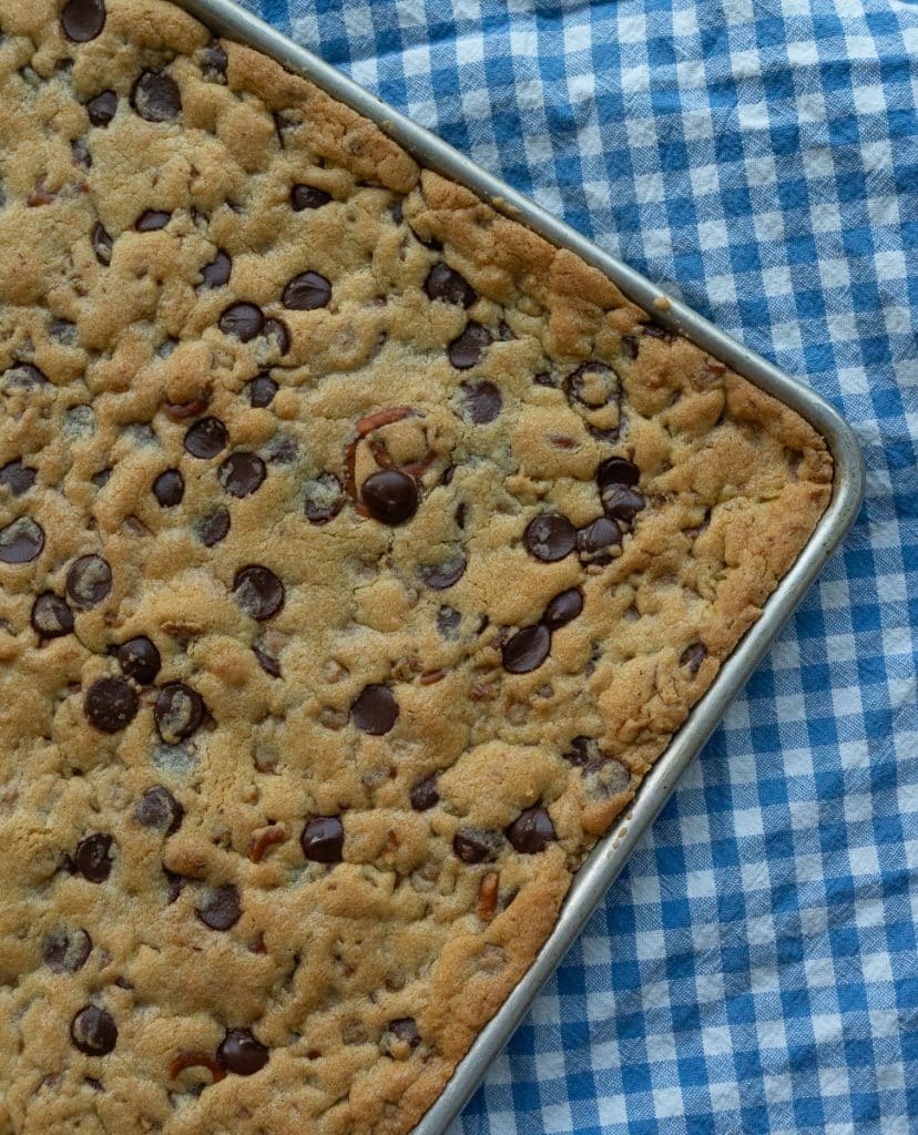 Pan of uncut caramel pretzel chocolate chip cookie bars
