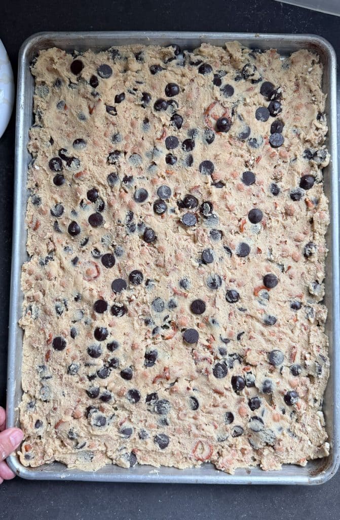 baking sheet with even layer of cookie dough spread into it