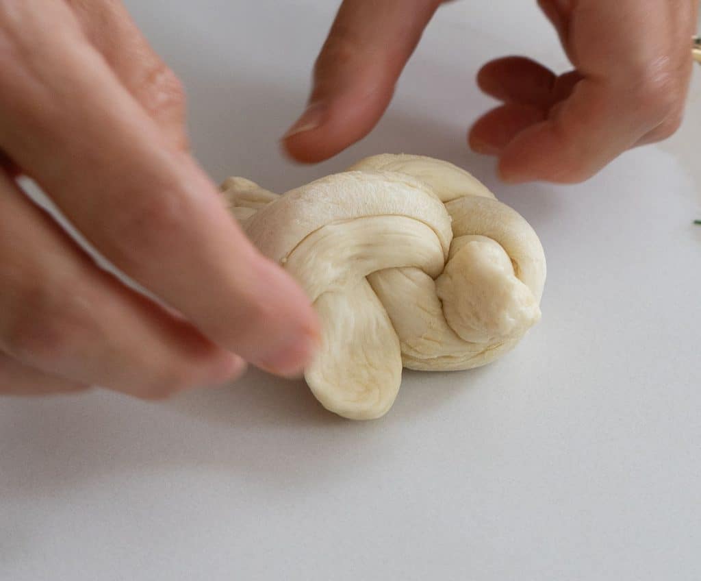 garlic knot all tied up setting on white kitchen countertop