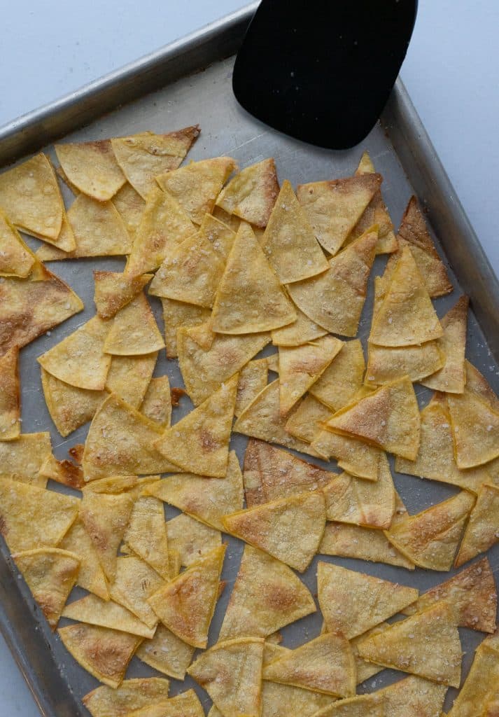 baked tortilla chips on a baking sheet