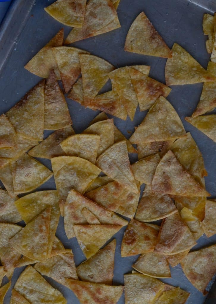baked tortilla chips on a baking sheet